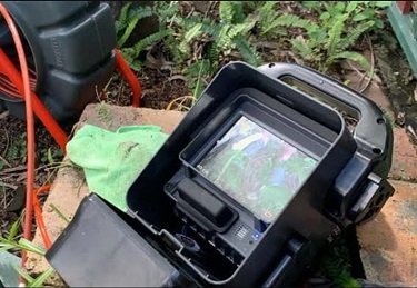 CCTV camera being used to inspect a blocked drain.