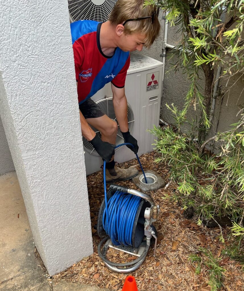 plumber fixing pipes